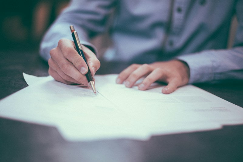 Printed regulatory documents on a desk